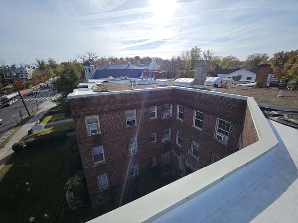 New aluminum parapet coping installed along the courtyard elevation of the apartment building at 2801 Pennsylvania Ave SE