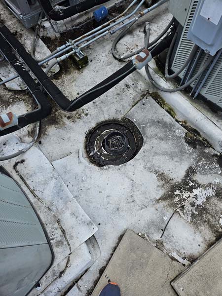 Existing roof drain assembly at 633 Pennsylvania Ave NW before TPO roof replacement