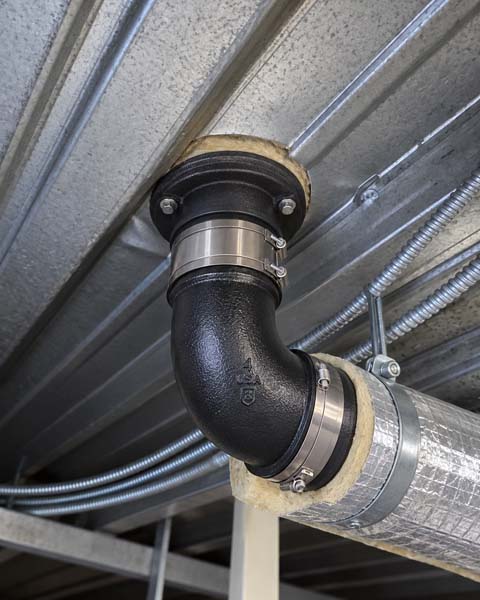 Rebuilt roof drain integrated into new Elevate TPO membrane at 633 Pennsylvania Ave NW